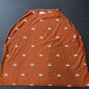 Itzy Ritzy Mom Boss 4-in-1 multi-use cover in the Terracotta Sun design.